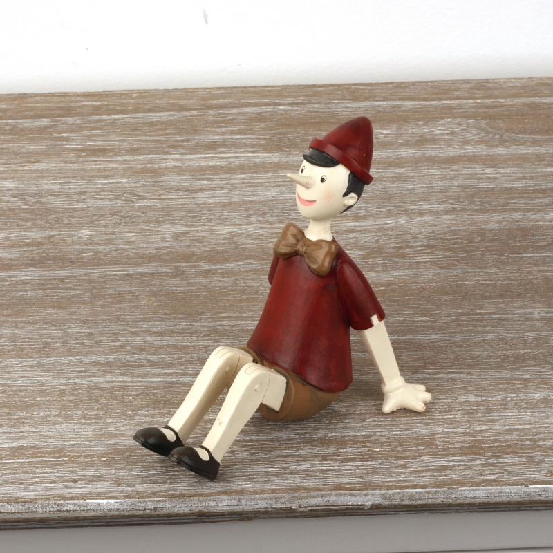 Dekorativní soška sedící Pinokio 15x11x14cm