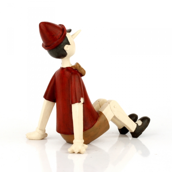 Dekorativní soška sedící Pinokio 15x11x14cm