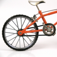 Dětské kolo kovové oranžové 25x17cm replika