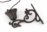 Litinový zvonek na konzolce 