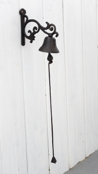 Litinový zvonek na konzolce 