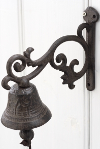 Litinový zvonek na konzolce 
